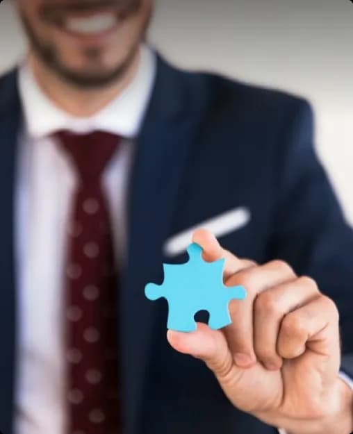 Person holding puzzle piece
